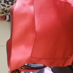 Red faux leather bag.